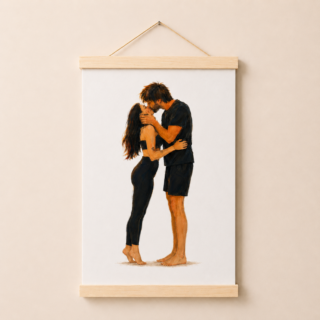 A vertical canvas wall art print featuring an illustration of a couple embracing and kissing, hanging from a light wood dowel with a string against a warm beige wall.